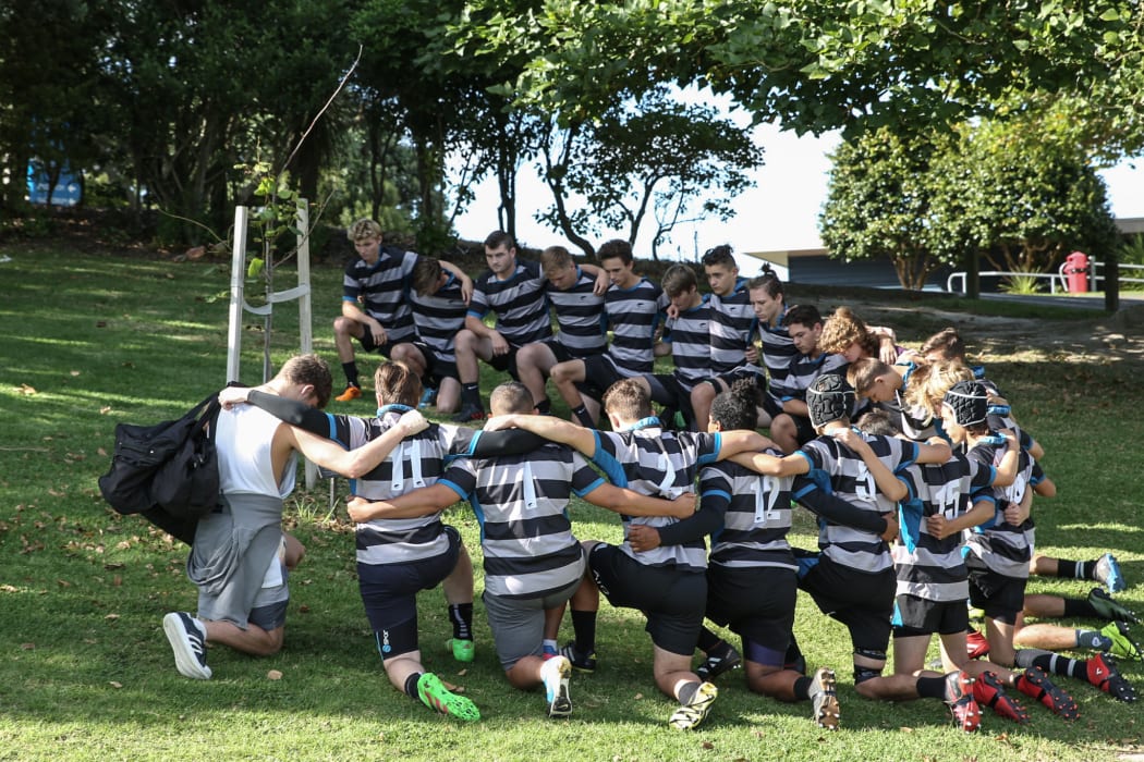 Current Long Bay First XV pay their respects to Peyo.