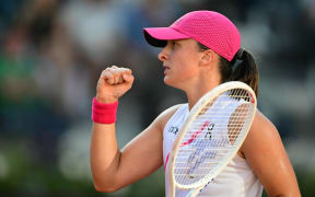 Poland's Iga Swiatek celebrates after winning against USA's Coco Gauff at the Women's WTA Rome Open tennis tournament at Foro Italico in Rome on May 16, 2024. (Photo by Tiziana FABI / AFP)