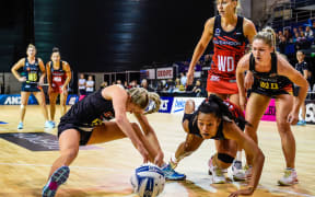 Monica Falkner of the Magic and Temalisi Fakahokotau of the Tactix fight for the ball.