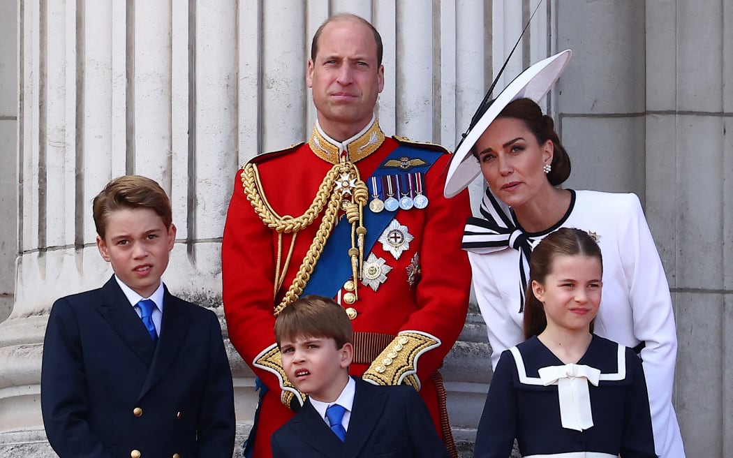 (L-R) Britain's Prince George of Wales, Britain's Prince William, Prince of Wales, Britain's Prince Louis of Wales, Britain's Catherine, Princess of Wales, and Britain's Princess Charlotte of Wales, stand on the balcony of Buckingham Palace after attending the King's Birthday Parade "Trooping the Colour" in London on June 15, 2024.