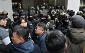 Soldiers try to enter the National Assembly building in Seoul on December 4 2024, after South Korea President Yoon Suk Yeol declared martial law.