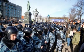 Russian riot police detain protesters during an opposition rally on March 26, 2017 in Moscow.