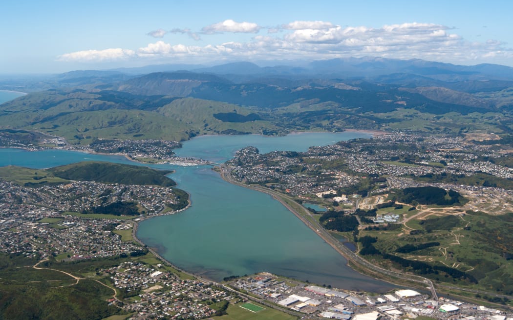 An aerial view of the two arms of Te Awarua o Porirua, with Parumoana inlet in foreground, Pāuatahanui inlet in the back.