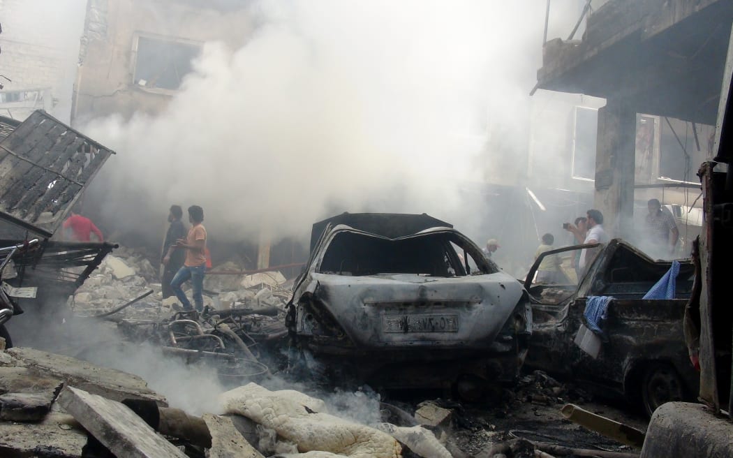 Smoke rises after Syrian army airstrikes in Idlib, Syria.