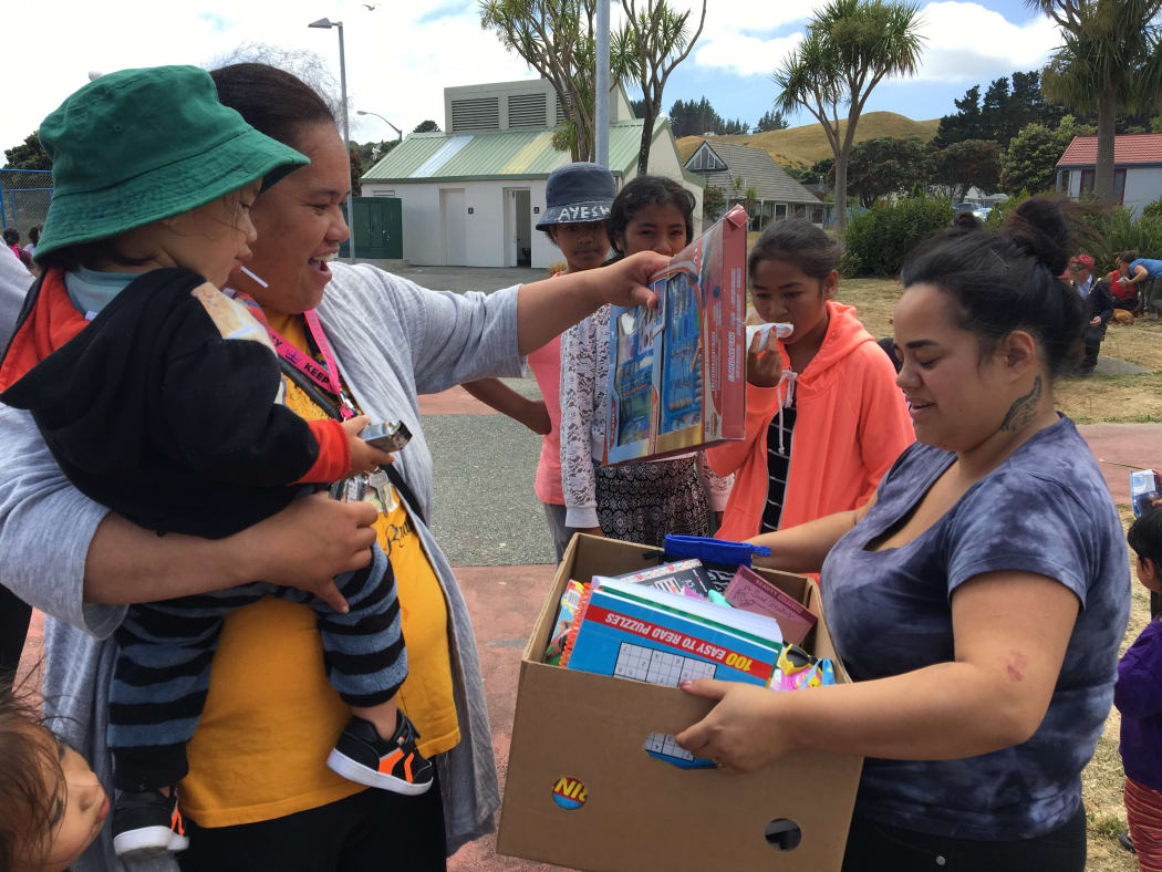 Waitangirua community Christmas Party. Locals received a free sausage sizzle, some received food hampers and christmas gifts were handed out to the children.