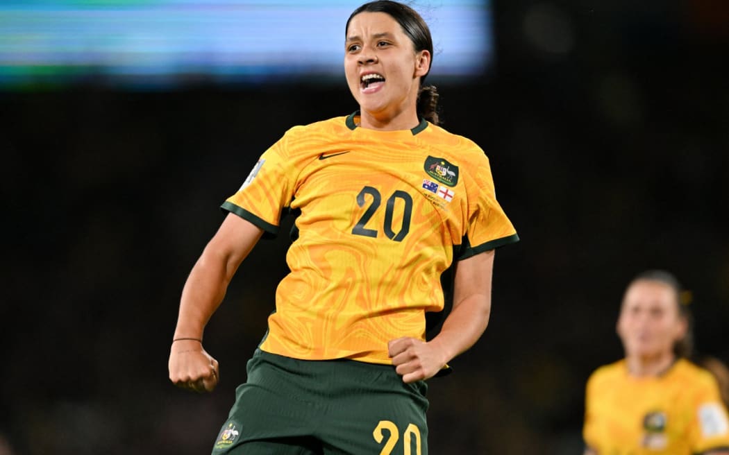 Australia's forward #20 Sam Kerr celebrates scoring her team's first goal during the Australia and New Zealand 2023 Women's World Cup semi-final football match between Australia and England at Stadium Australia in Sydney on August 16, 2023. (Photo by Izhar KHAN / AFP)