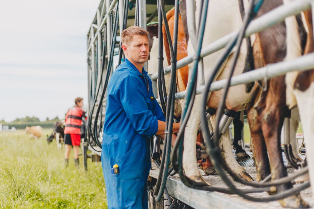 Glen Herud with his mobile milking machine he's since had to sell.
