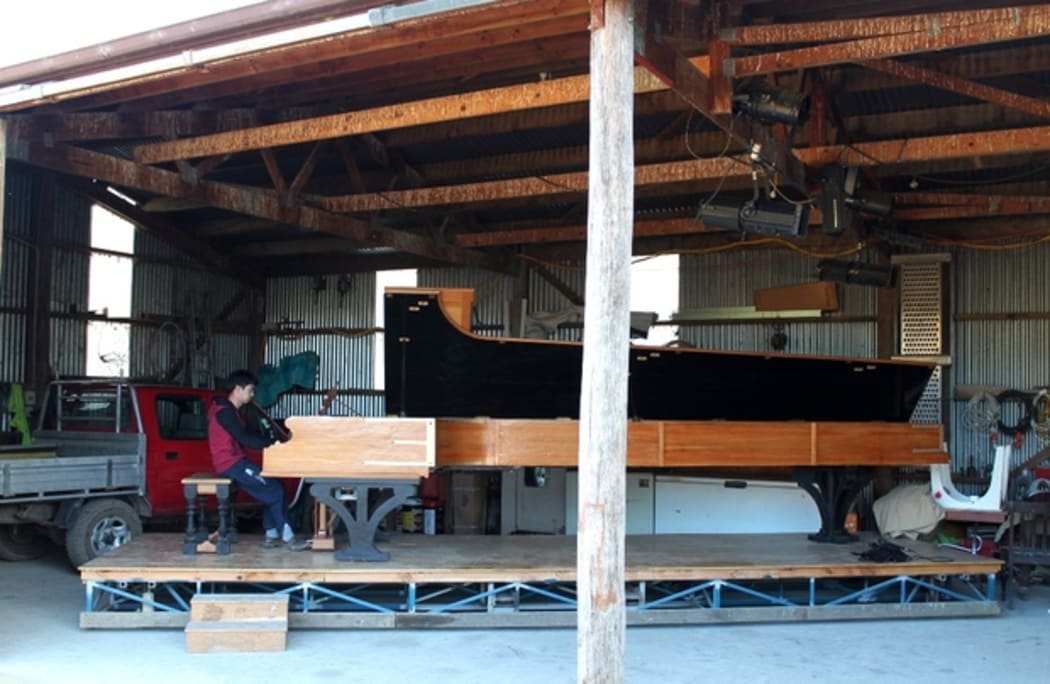 Adrian Mann and his long piano
