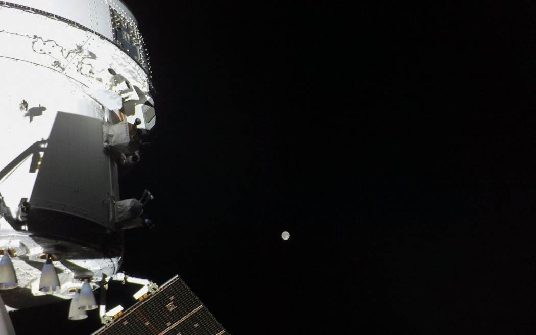 Orion spacecraft with Moon in the distance