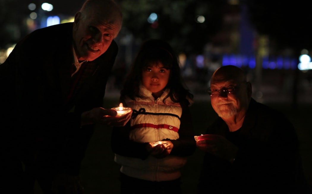 Candlelight vigil for Nepal. Peter Hillary, Rosalynne Basnet and Sir Ray Avery.