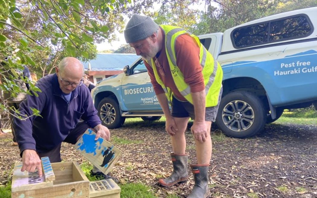 Piha NZ Dotterel Minder Dudley Bell and Council Conservation Advisor Chris Bindon at Tai Haruru Lodge before roost box installation.