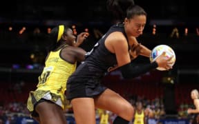 Silver Ferns goal attack Maria Tutaia battles against Jamaica at the 2015 world champs in Sydney.