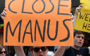 Refugee advocates protest in Manly against Australia's treatment of refugees, on 22 February 2014.