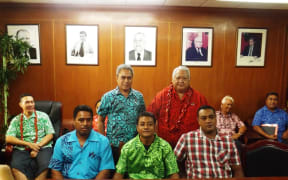 From right PM Tuilaepa Sailele Malielegaoi and Minister of Finance Sili Epa Tuioti, standing behind the first three carpenters from Samoa to work in Christchurch NZ.