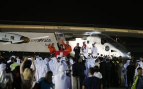 Solar Impulse 2, the solar powered plane, and crew are greeted upon arrival at Al Batin Airport in Abu Dhabi.