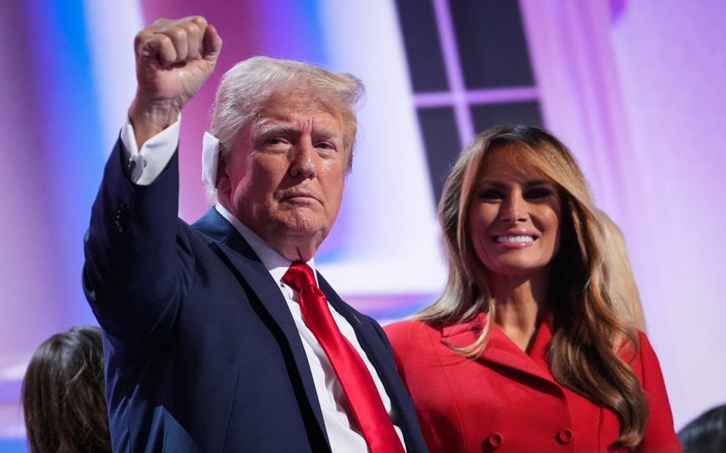 MILWAUKEE, WISCONSIN - JULY 18: Former first lady Melania Trump joins Republican presidential nominee, former U.S. President Donald Trump on stage after he officially accepted the Republican presidential nomination on the fourth day of the Republican National Convention at the Fiserv Forum on July 18, 2024 in Milwaukee, Wisconsin. Delegates, politicians, and the Republican faithful are in Milwaukee for the annual convention, concluding with former President Donald Trump accepting his party's presidential nomination. The RNC takes place from July 15-18.   Andrew Harnik/Getty Images/AFP (Photo by Andrew Harnik / GETTY IMAGES NORTH AMERICA / Getty Images via AFP)