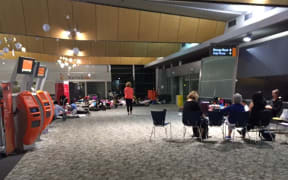 A group from an Auckland primary school prepare to spend the night at Wellington Airport.