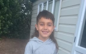 Azaiah Clausen, now 7, was attacked by a dog at a motel room when he was three.