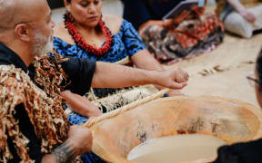 Teolotai Paitai (Taukava, kava mixer) prepares the ceremonial kava.