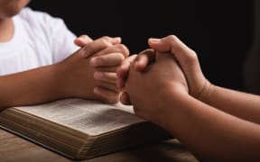 Children praying.