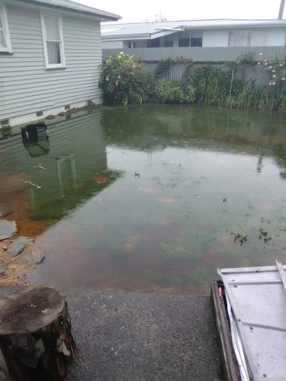 Faith Traill and her family have had faeces and toilet paper flowing past her back door in Masterton's Colombo Road in bad weather.