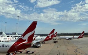 February 23, 2015 shows a Qantas plane leaving a departure gate at Melbourne International Airport.