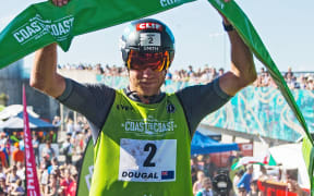Dougal Allan crosses the finish line to win the Elite category. Kathmandu Coast To Coast. New Brighton, Christchurch 9th February 2019.
Copyright photo: Craig Morrison / www.photosport.nz