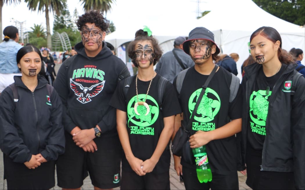 Aorere College kapa haka performers roaming the Polyfest grounds after their performance on stage - day 2 Polyfest 2021