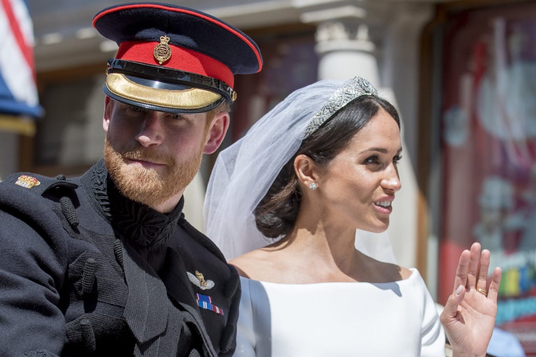 Prince Harry, Duke of Sussex and Meghan Markle, Duchess of Sussex in the Ascot Landau carriage during the procession on The Long Walk after getting married St George's Chapel, Windsor Castle.