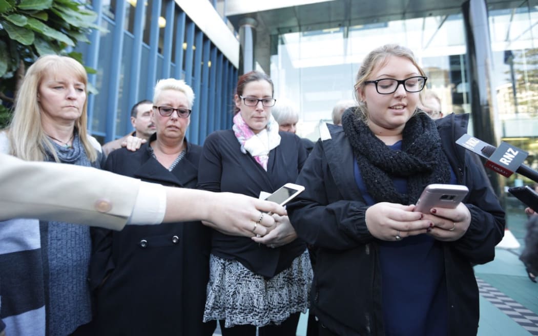 Gracie's family, including her mother Charlotte McSorley, second from left, and her aunt Victoria Balmforth, far right, speak to media.