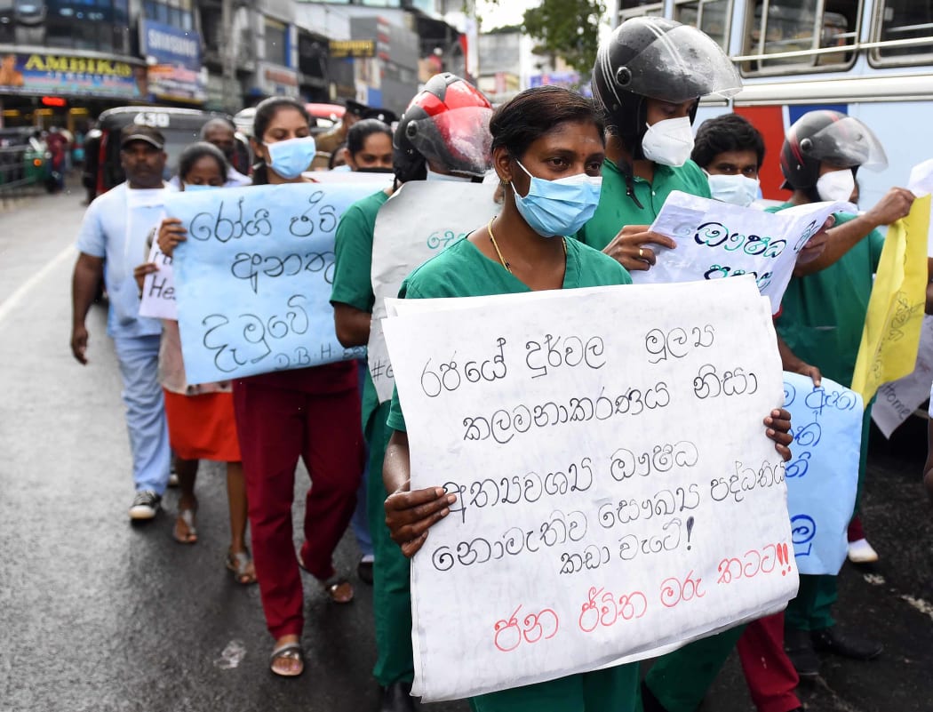 Doctors, paramedics and workers of Maussakalay hospital at Hatton in Sri Lanka protesting over the country's economic crisis on 8.4.22. "We are worried. There is a huge shortage of medicines and there is no diesel for the ambulances," one protester said.