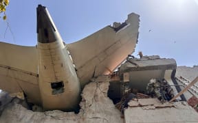 The back of an Air India plane after it crashed in a residential area near the airport in Ahmedabad.