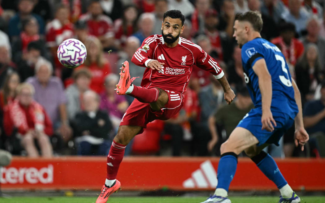 Liverpool's Egyptian striker Mohamed Salah crosses the ball against Bournemouth.