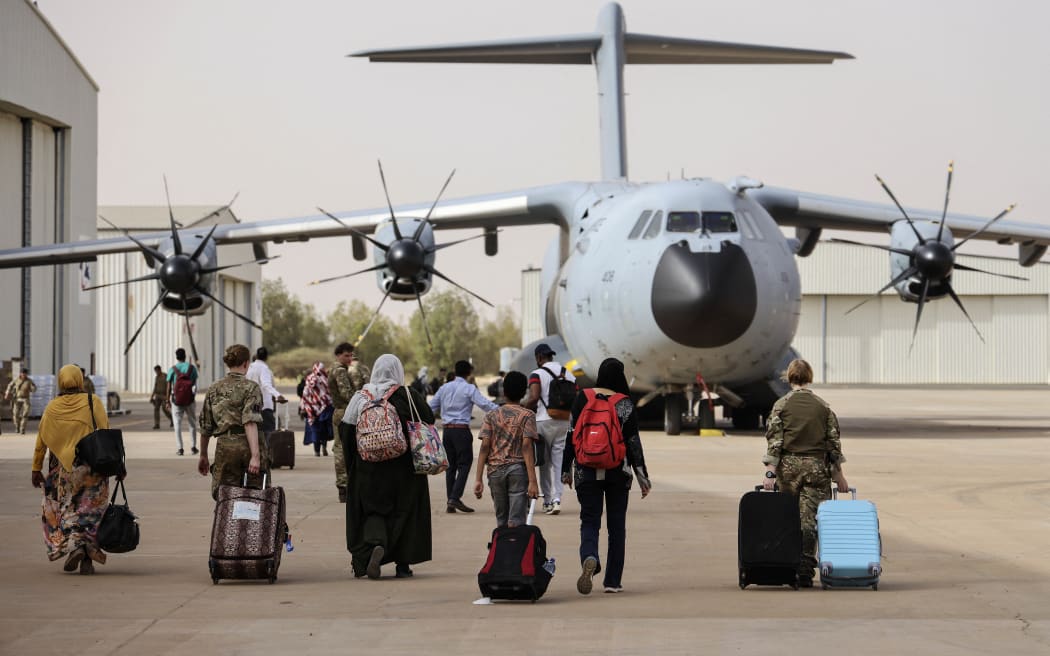 2023, and taken on April 26, shows British Nationals boarding an RAF aircraft in Sudan, for evacuation to Larnaca International Airport in Cyprus. (Photo by Arron Hoare/AFP PHOTO