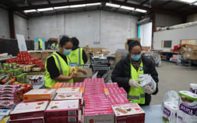 The Fono's staff prepare groceries to help Covid-19 hit families in the Church of Sāmoa cluster