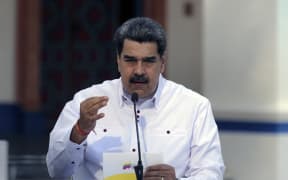Venezuela's President Nicolas Maduro speaking  during a broadcast message at Miraflores Presidential Palace in Caracas on 4 April 2021.