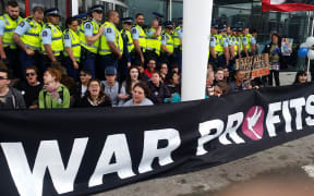 Protesters outside the annual conference of the New Zealand Defence Industry Association.