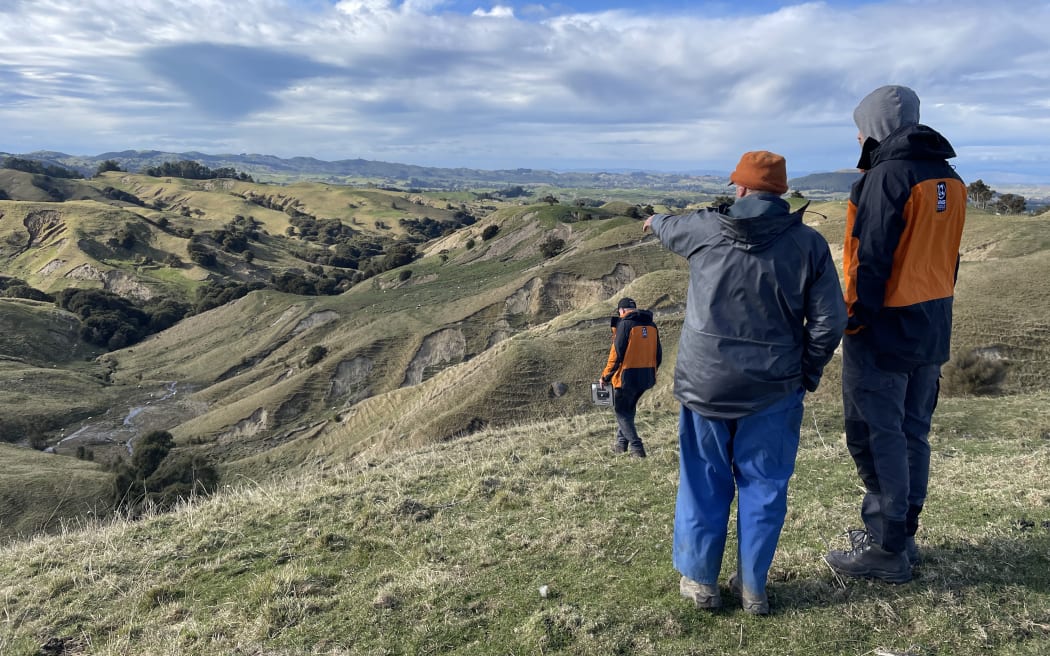 Scientists at Trigham Station in Hawke's Bay, surveying the land following Cyclone Gabrielle.