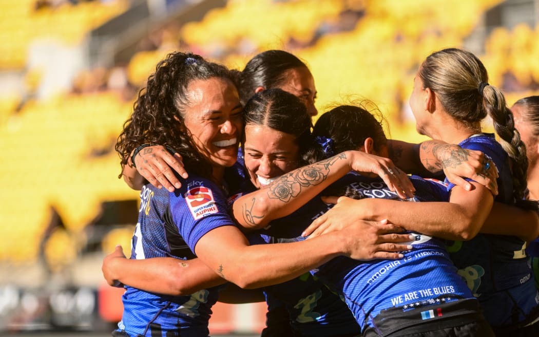 Team celebrates Braxton Sorensen-McGee of the Blues scoring a try. Super Rugby Aupiki Hurricane Poua v nib Blues Women at Sky Stadium.