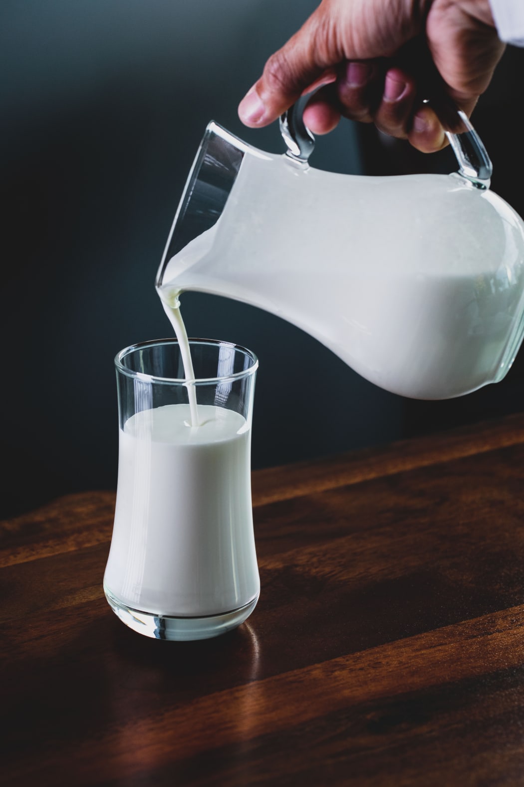 Milk being poured into glass