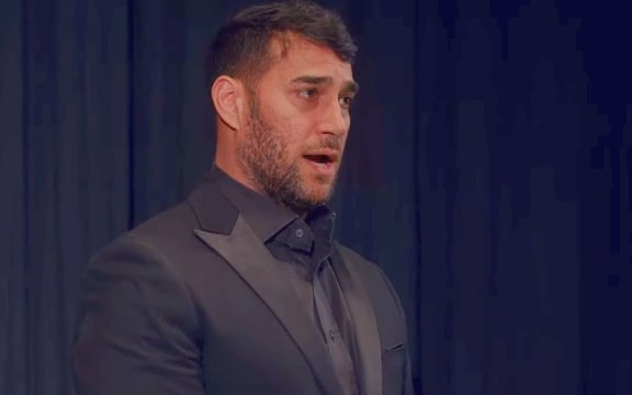 Phillip Rhodes singing in Whānau London concert