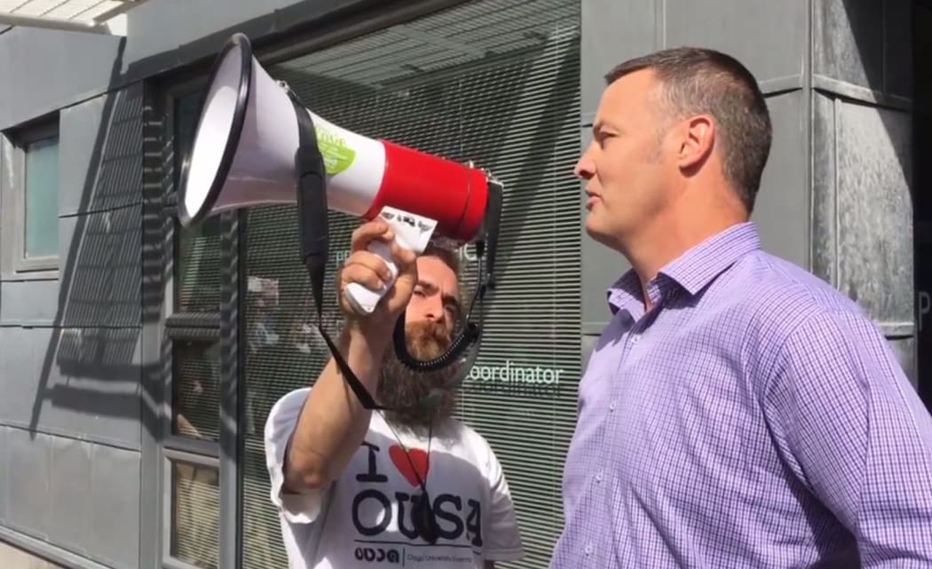 Otago University's proctor says sorry to protesters on Friday via a Students Association bullhorn.