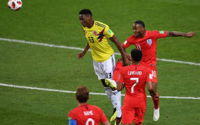 Colombia's defender Yerry Mina (C) vies with England's forward Raheem Sterling (R) during the Russia 2018 World Cup round of 16 football match between Colombia and England at the Spartak Stadium in Moscow on July 3, 2018.