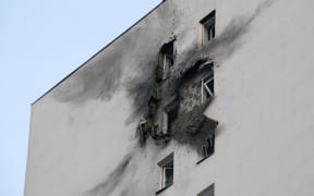 A view shows a damaged apartment building in a residential complex following a drone attack in the village of Sapronovo in the Moscow region on March 11, 2025. Ukraine targeted Moscow with dozens of drones in a "massive" overnight attack, the city's mayor said on March 11, 2025.
