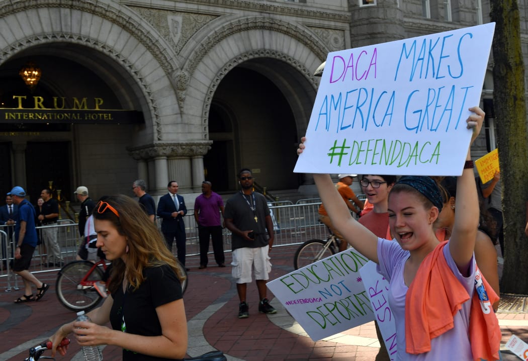Immigrants and supporters demonstrating during a rally in support of the Deferred Action for Childhood Arrivals (DACA) program outside Trump International Hotel in Washington DC in September.