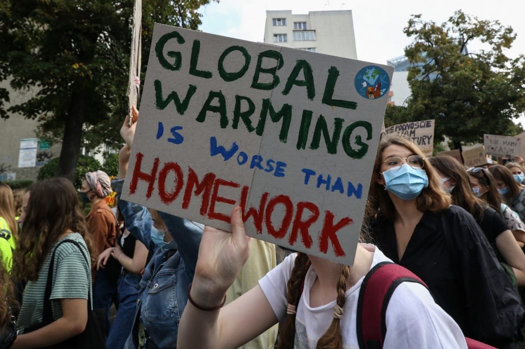 Young protesters with pro-climate banners are seen in Gdansk, Poland, on 25 September 2020