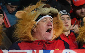Lions fans celebrate their win during the rugby union match between the Crusaders and the British and Irish Lions at AMI Stadium in Christchurch on June 10, 2017.