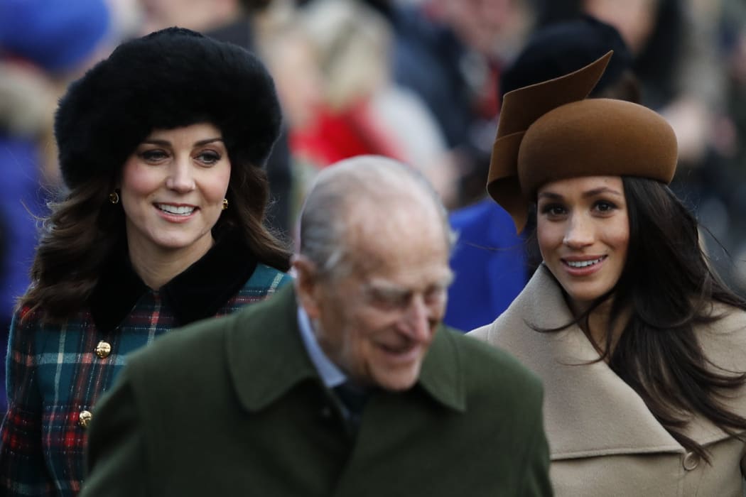 (L-R) Britain's Catherine, Duchess of Cambridge, Britain's Prince Philip, Duke of Edinburgh and US actress and fiancee of Britain's Prince Harry Meghan Markle (R) arrive to attend the Royal Family's traditional Christmas Day church service.