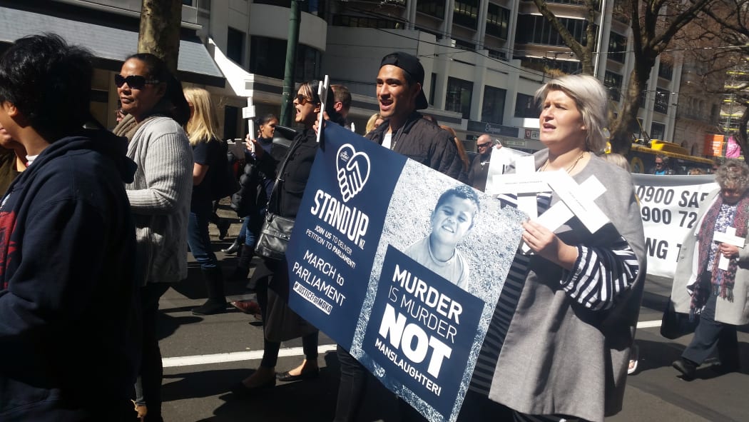 Protesters march to Parliament to deliver a petition calling for an end to plea bargaining.