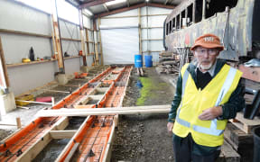 Don Selby, Society president Don Selby stands inside a workshop.